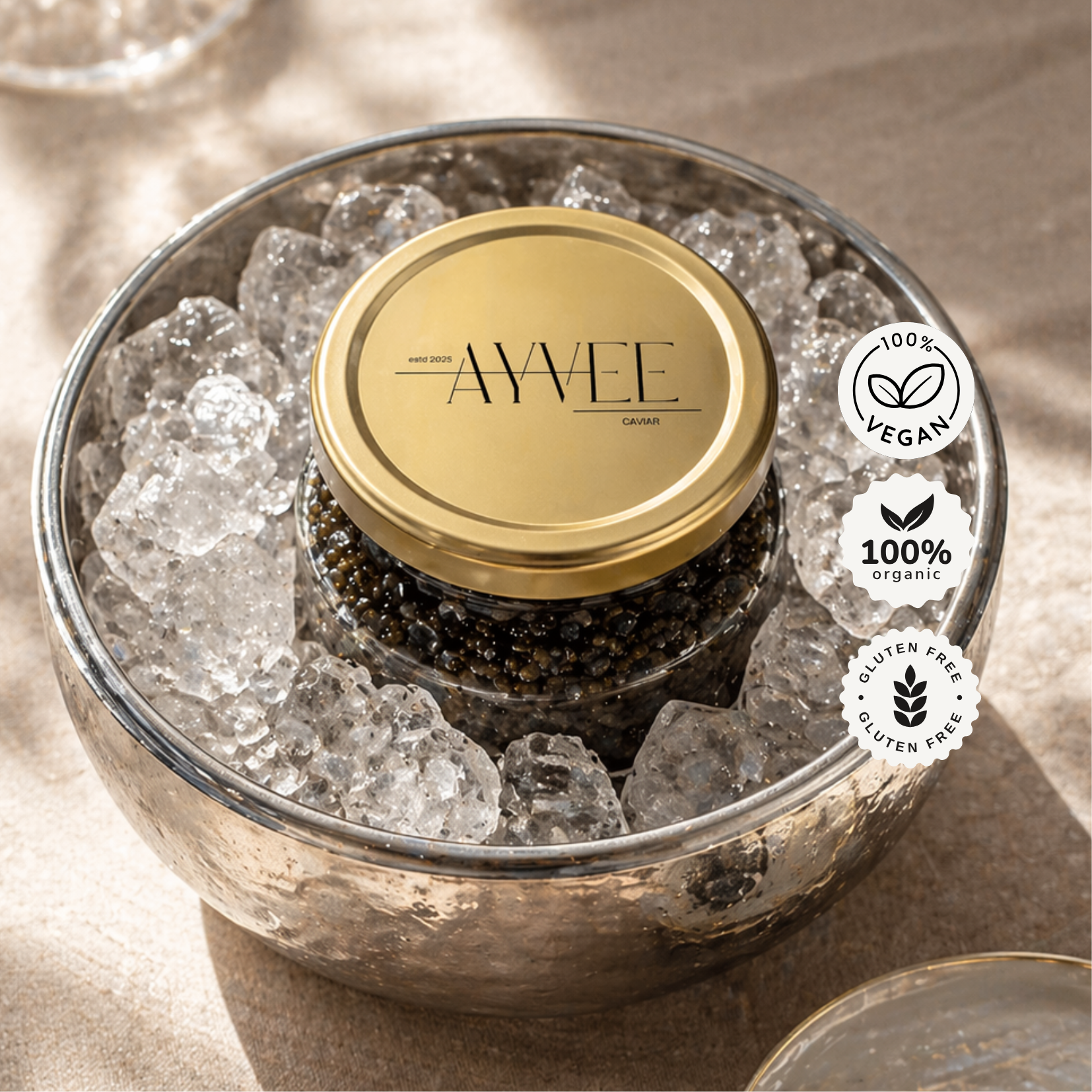 Jar of caviar with gold lid on ice, branded 'AVVEE', with vegan and organic labels.