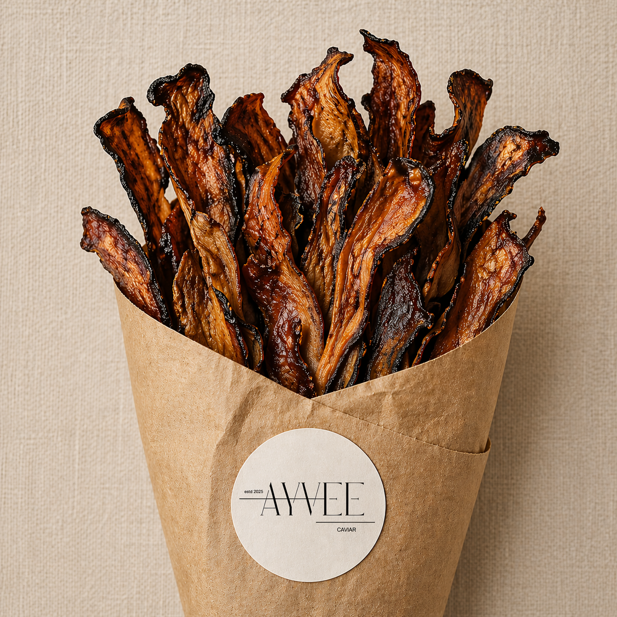Bunch of dried beef jerky in a brown paper bag with 'AYVEE' label on a beige background